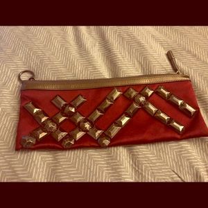 Burberry evening clutch in deep red.